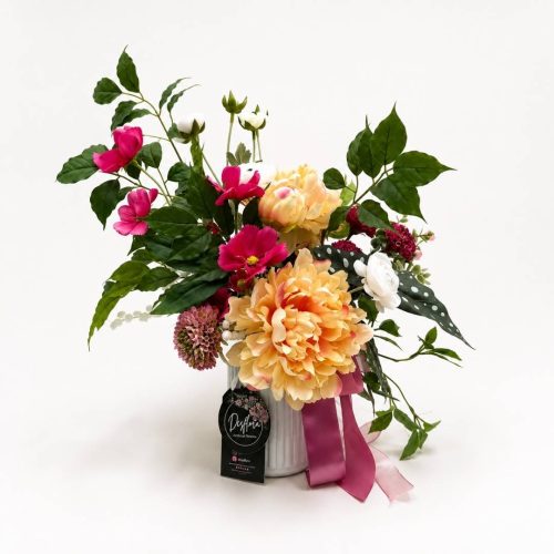 Artificial Flower Arrangement Chloe with hot pink, yellow and white artificial flowers in a modern white ceramic vase by Desflora